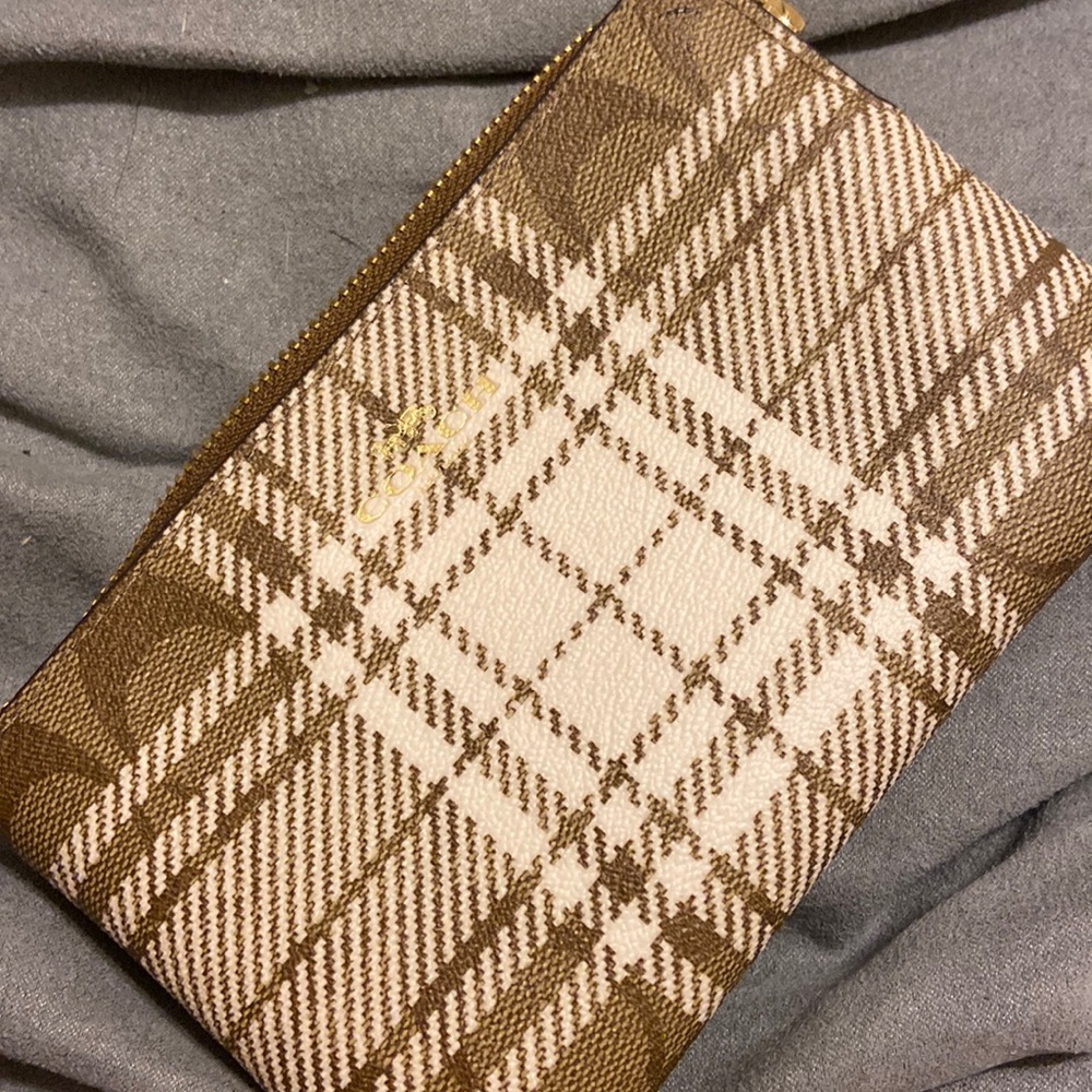 Coach tan wristlet with logo